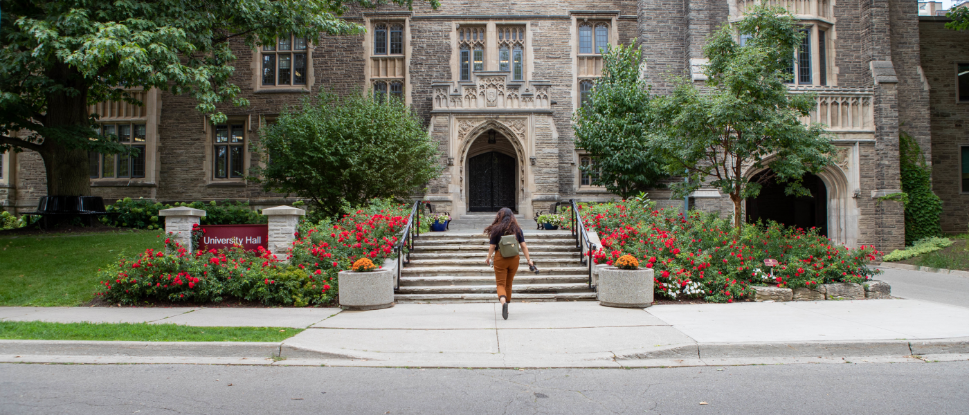 Student in front of University Hall