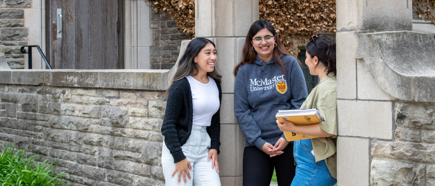 Students standing at chatting at Edwards Arch.