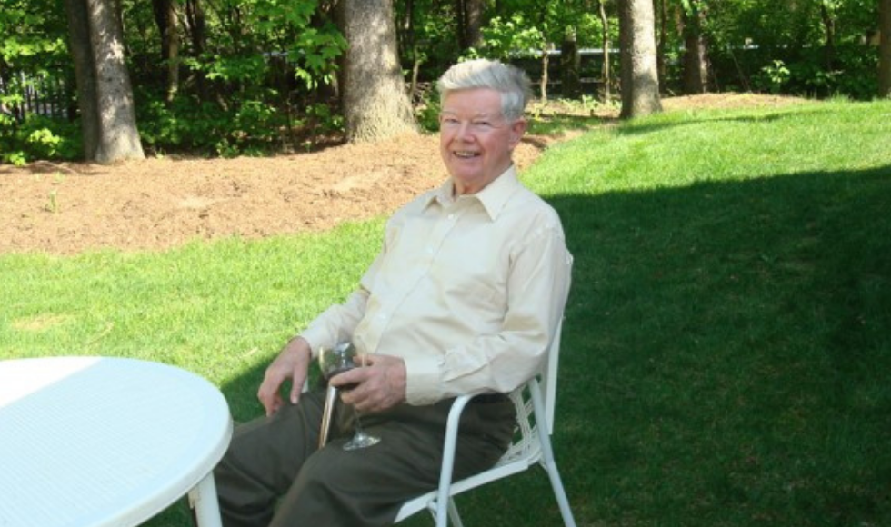 A photo of Alan Hitchen sitting down.