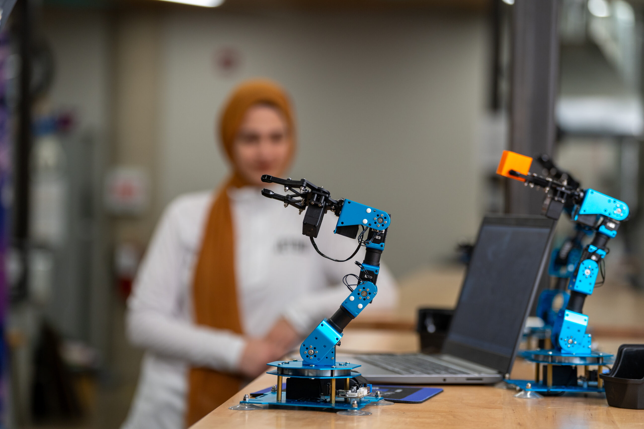 Michael Jobity, founder of Jetson Infinity and McMaster Engineering graduate, showcasing his robotic arm technology in Thode Library's Makerspace.